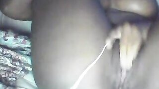 Ebony babe plays with pussy