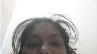 Indian girl plays with water bottle.