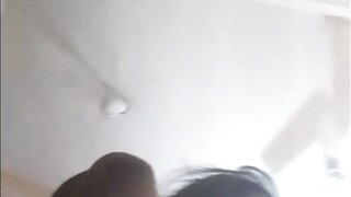 Indian girl plays with water bottle.