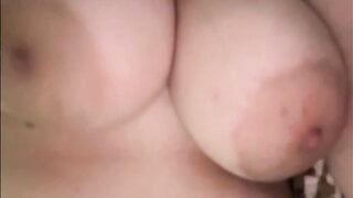 American girl plays with huge tits and shows pussy