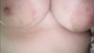 American girl plays with huge tits and shows pussy