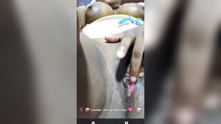 Beautiful Colombian girl is fingering her juicy pussy