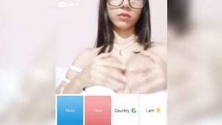 Beautiful glsses girl playing with her boobs