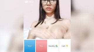 Beautiful glsses girl playing with her boobs