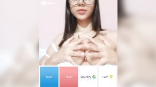 Beautiful glsses girl playing with her boobs