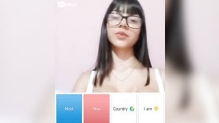 Beautiful glsses girl playing with her boobs